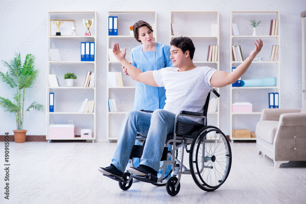 Patient undergoing rehabilitation recovery programme with doctor Patient undergoing rehabilitation recovery programme with doctor