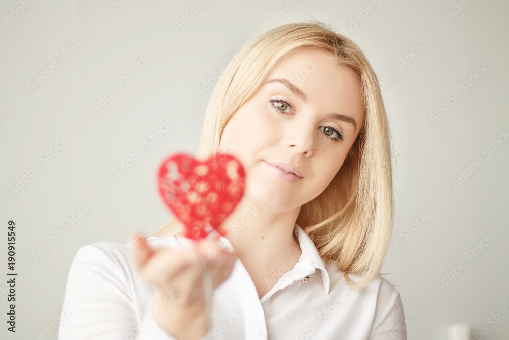 Valentine's day, heart in hand, a young beautiful girl Valentine's day, heart in hand, a young beautiful girl