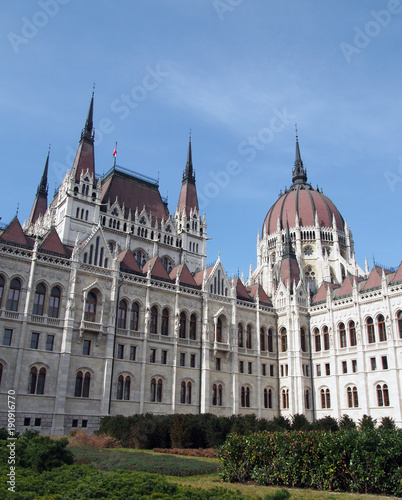 the historic hungarian Parliament building in Budapest with domes spires and blue sky