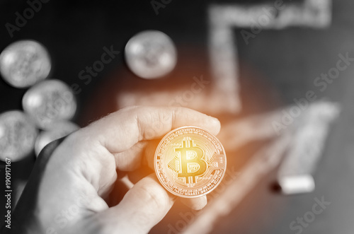 Bitcoin in Businessman hand
