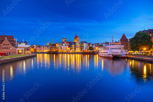 Architecture of the old town in Gdansk over Motlawa river at dusk, Poland
