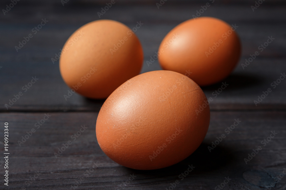 Eggs of brown chicken on a wooden background with copy space in rustic vintage style Eggs of brown chicken on a wooden background with copy space in rustic vintage style