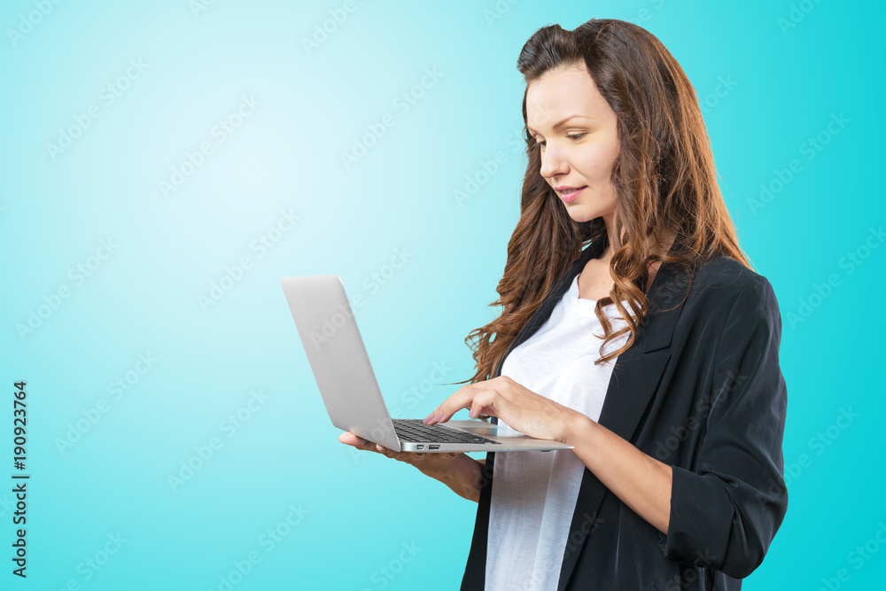 Portrait of young beautiful brunnete woman holding laptop Portrait of young beautiful brunnete woman holding laptop