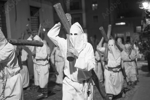 procession that takes place on Easter Friday in Civitavecchia, in Italy. There are men and women hooded in penitence