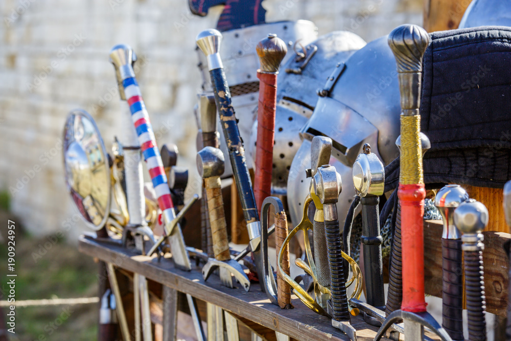 Swords in a medieval fair kept in sword display stand