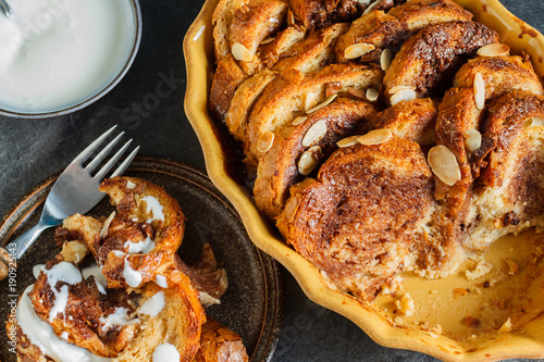 Homemade rustic bread pudding with chocolate and almonds photo