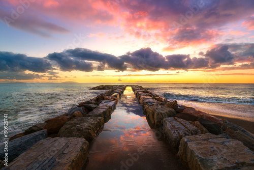 Pier in Maremma coast. Marina di Cecina, Tuscany, Italy photo