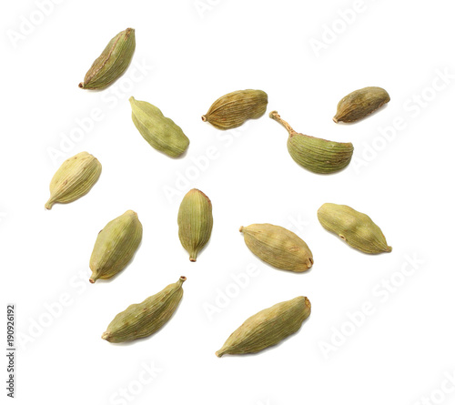 Pile of green Cardamom, cardamon or cardamum (dried fruits of Elettaria cardamomum) isolated on white. shadow separated top view