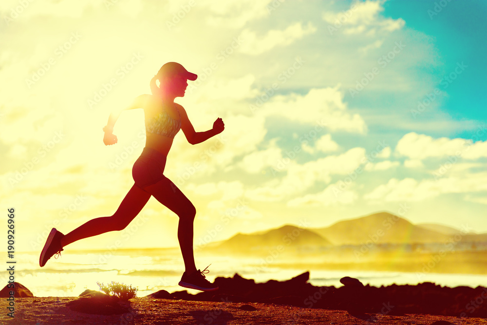 Foto Stock Summer fitness healthy active woman running on beach against sun  flare at sunset. Runner athlete sport girl jogging on trail run race on  nature landscape. Fit active lifestyle. | Adobe
