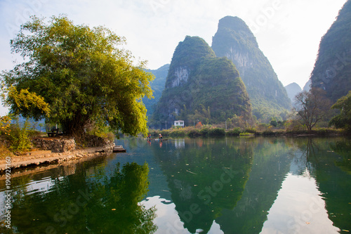 Beautiful landscape of karst mountains reflected in water  Yulong river in Yangshuo South China.