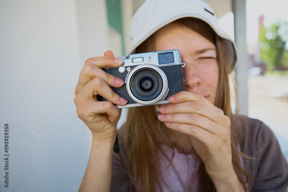 Young Woman Looking Through a Camera Young Woman Looking Through a Camera