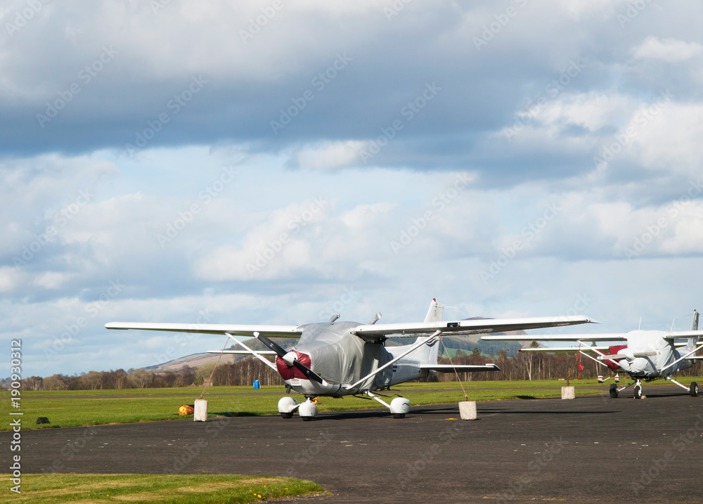 Small single-engine airplane parjed on runway Small single-engine airplane parjed on runway
