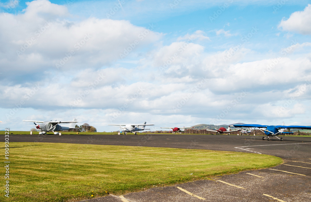 Overall view on airport with parked sport airplains Overall view on airport with parked sport airplains