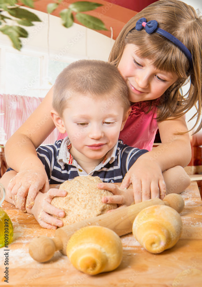 Fototapeta premium happy children doing bread homemade