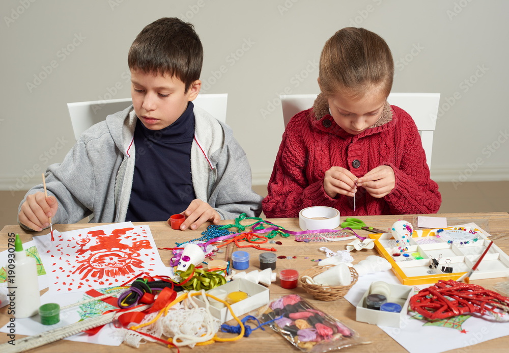 Children make crafts and toys, handmade concept. Artwork workplace with creative accessories. Children make crafts and toys, handmade concept. Artwork workplace with creative accessories.