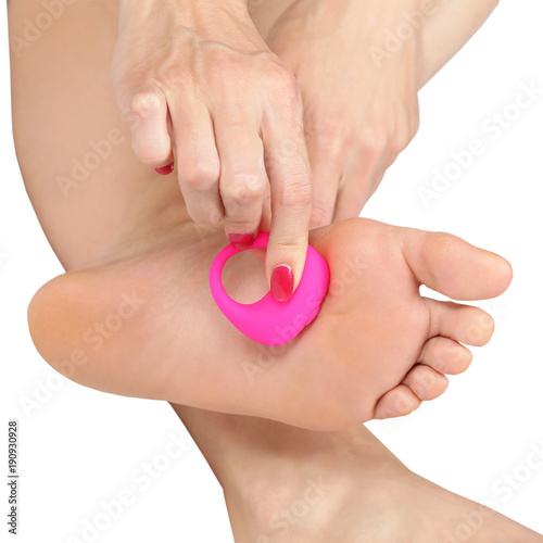 woman doing foot massage with a massager
