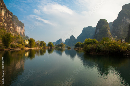 Amazing natural landscape. Beautiful karst mountains reflected in the water of Yulong river, in Yangshuo, Guangxi province, China.
