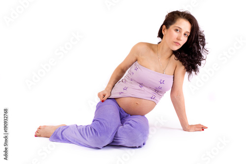 Beautiful pregnant girl on white background