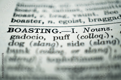 closeup of the word boasting in the dictionary photo