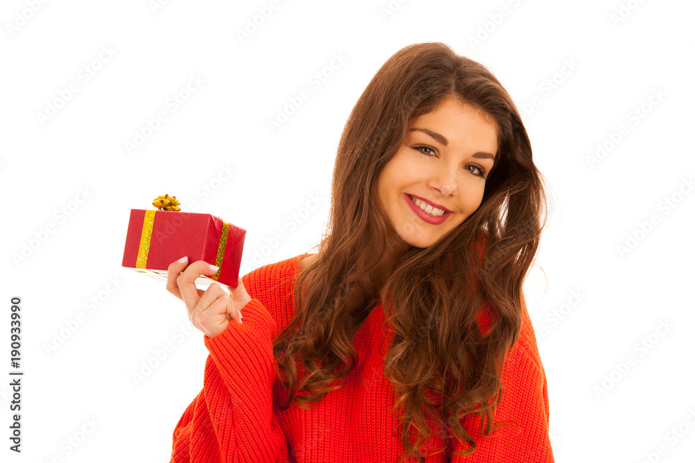 Beautiful young teenage girl holds a present islated over white background Beautiful young teenage girl holds a present islated over white background