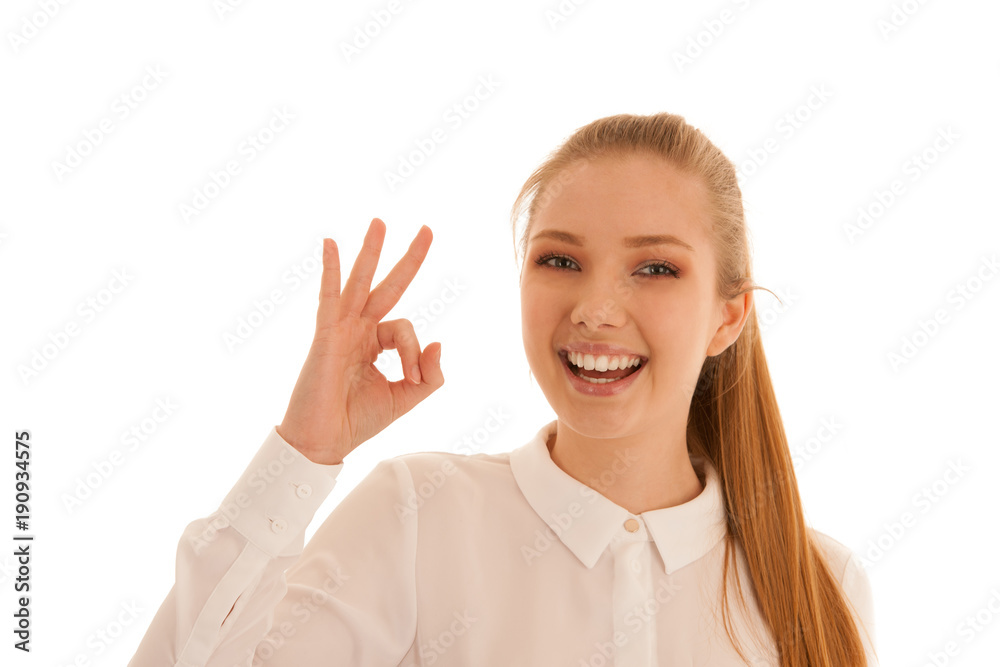 Beautiful business woman shows excellent sigh isolated over white background Beautiful business woman shows excellent sigh isolated over white background