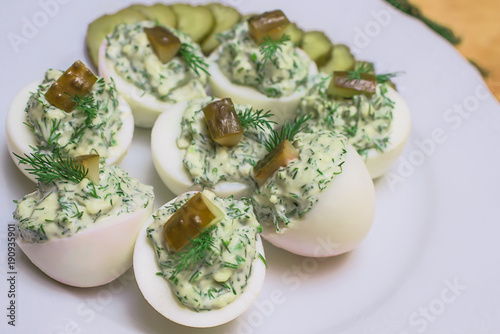 Deviled eggs with greens and pickles