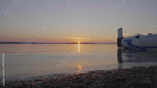 Sunrise at at tranquil lake before a clear sky