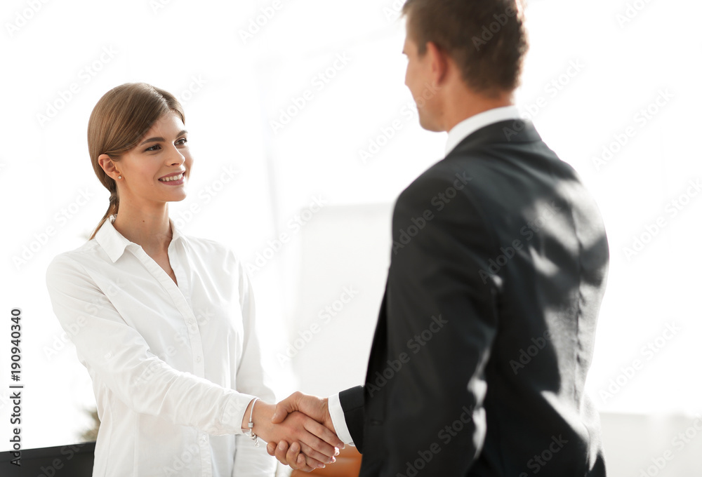 handshake young business woman with a colleague handshake young business woman with a colleague