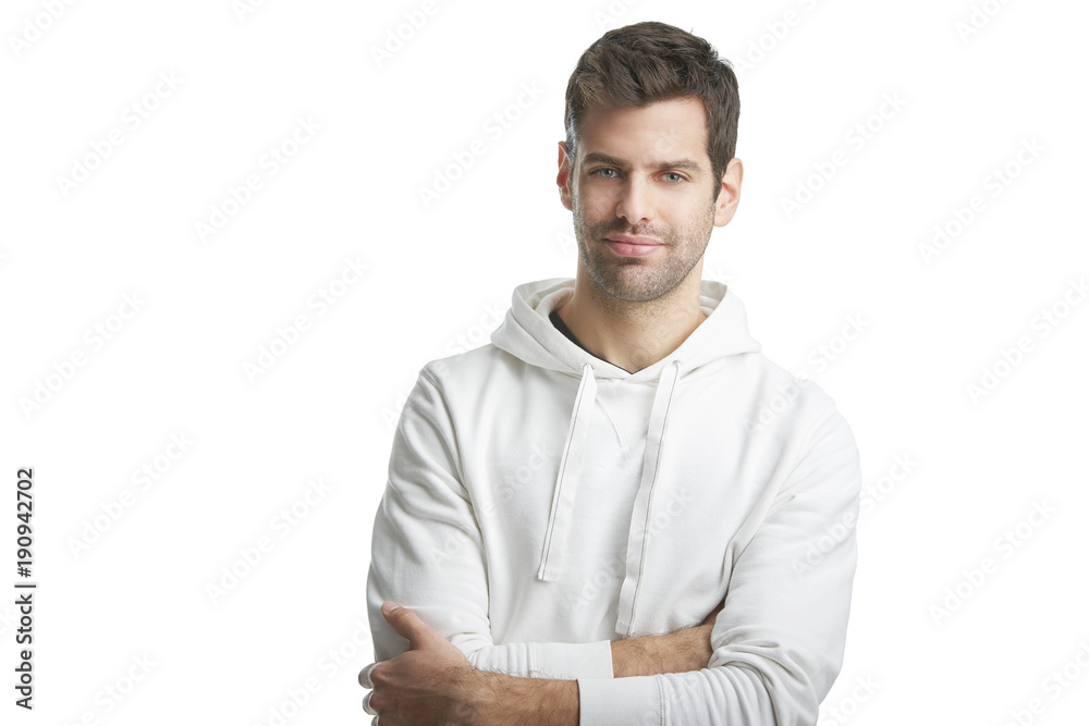 Casual young man portrait. Portrait of young man wearing hoodie while standing at isolated white background with copy space. Casual young man portrait. Portrait of young man wearing hoodie while standing at isolated white background with copy space.