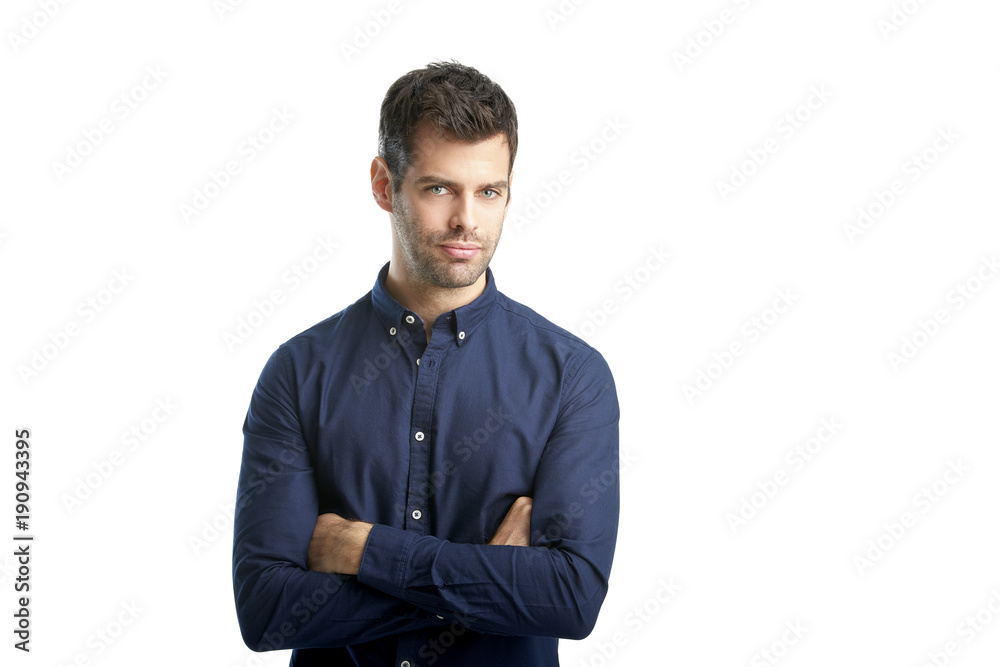 Confident young professional man portrait. Smiling young businessman standing at isolated white background and looking at camera. Confident young professional man portrait. Smiling young businessman standing at isolated white background and looking at camera.