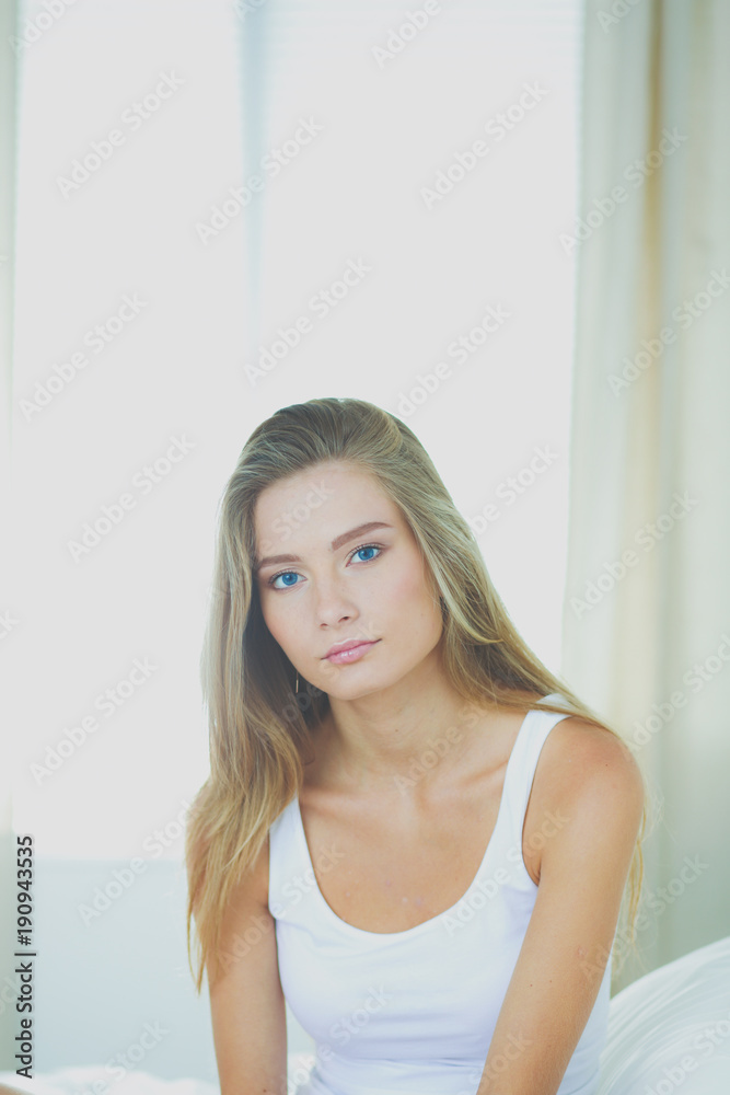 Beautiful woman showing heart shape on her hand , sitting bed. Beautiful woman Beautiful woman showing heart shape on her hand , sitting bed. Beautiful woman