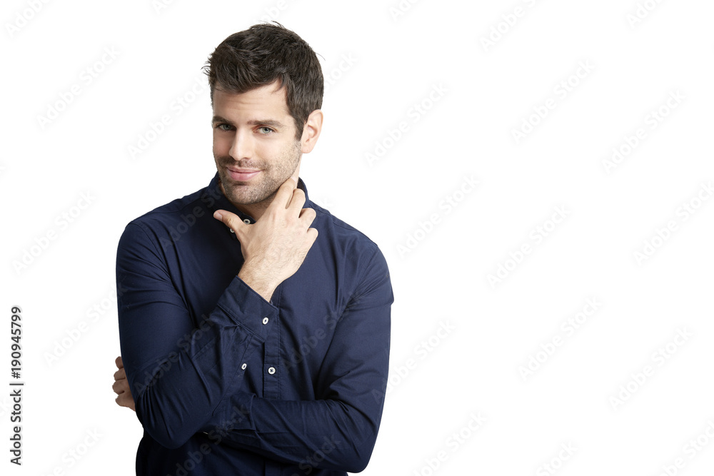 Young man portrait. Businessman wearing shirt while looking at camera and standing against at isolated white background. Young man portrait. Businessman wearing shirt while looking at camera and standing against at isolated white background.
