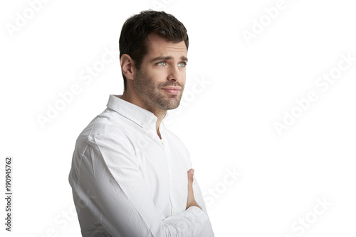 Young man portrait. Businessman wearing shirt and standing against at isolated white background. 