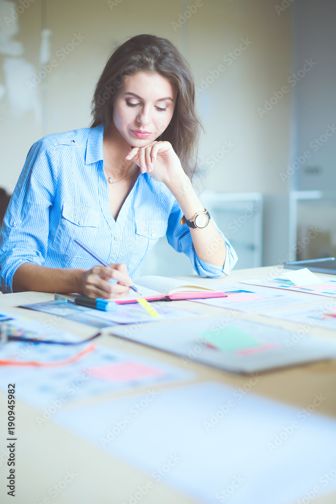 Young woman sitting at office table . Young woman. Young woman sitting at office table . Young woman.