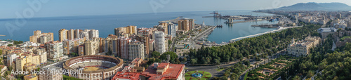 Panorama City skyline and harbour, sea port, bullring of Malaga overlooking the sea ocean in Malaga, Spain, Europe