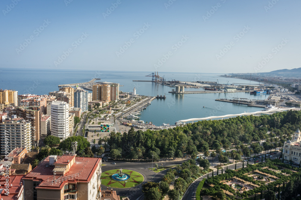 City skyline and harbour, sea port of Malaga overlooking the sea ocean in Malaga, Spain, Europe on a bright summer day