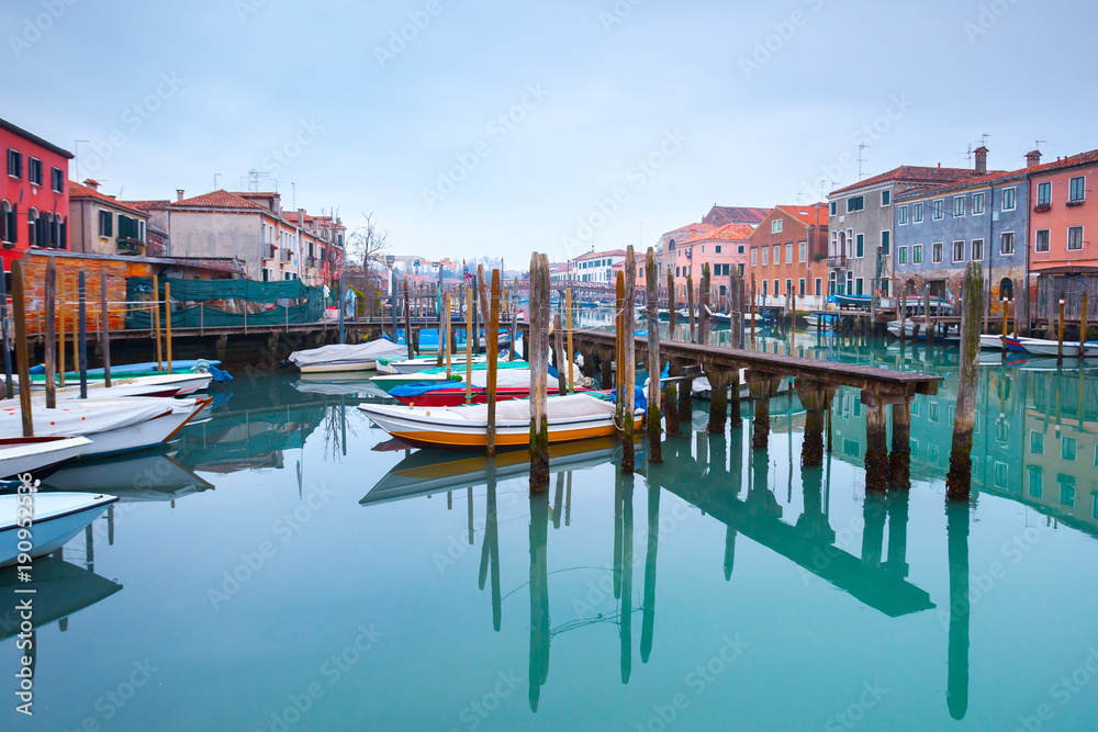 Wintertime of the rainy weather. Emerald water in the canals at low tide. Less known are not tourist destinations in the Castello-Arsenale. Venice. Italy.
