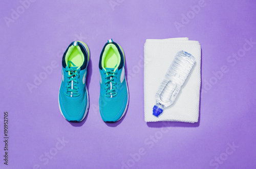 Fitness accessories  healthy and active lifestyles concept background with copy space for text. Products with vibrant  punchy pastel colours and frame composition. Image taken from above  top view.