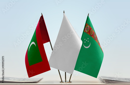 Flags of Maldives and Turkmenistan with a white flag in the middle