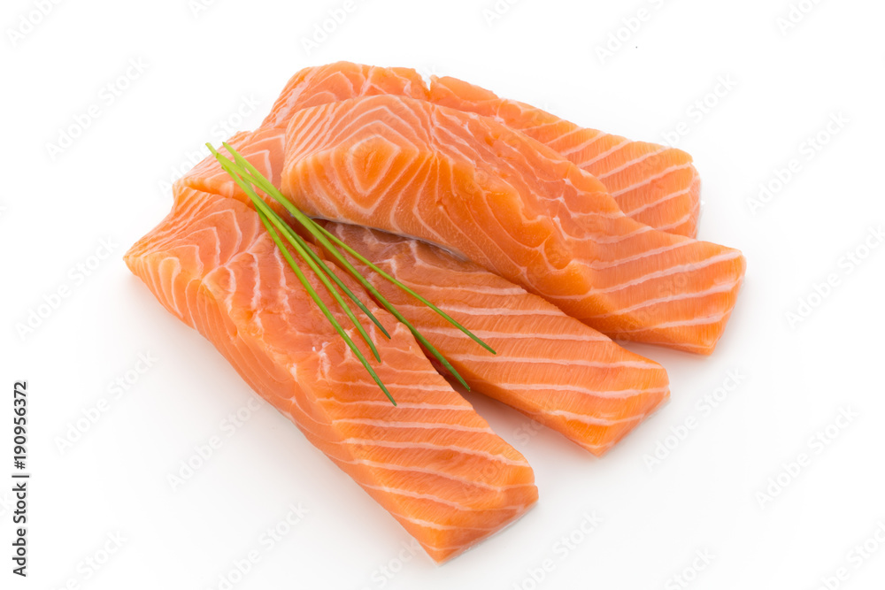 Fresh salmon fillet with basil on the white background.