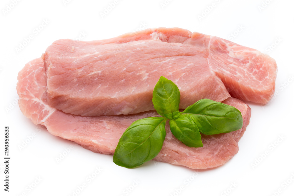 Fresh pork fillet with basil on a white background. Fresh pork fillet with basil on a white background.
