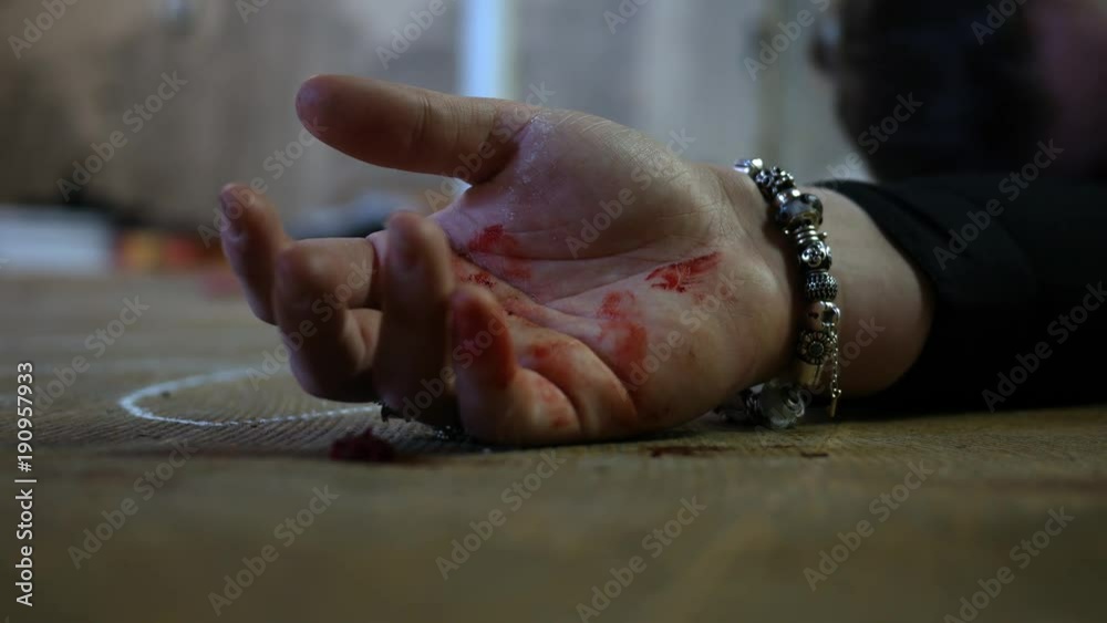 Murder Victim clings to life after brutal attack - bloody female hand