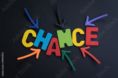 Concept chance in life or career path, job or work journey, colorful arrows pointing to the word CHANCE at the center on black chalkboard, motivation for life target or success in work