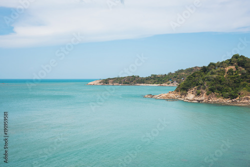 a day of nature island in green sea ocean blue sky white cloud