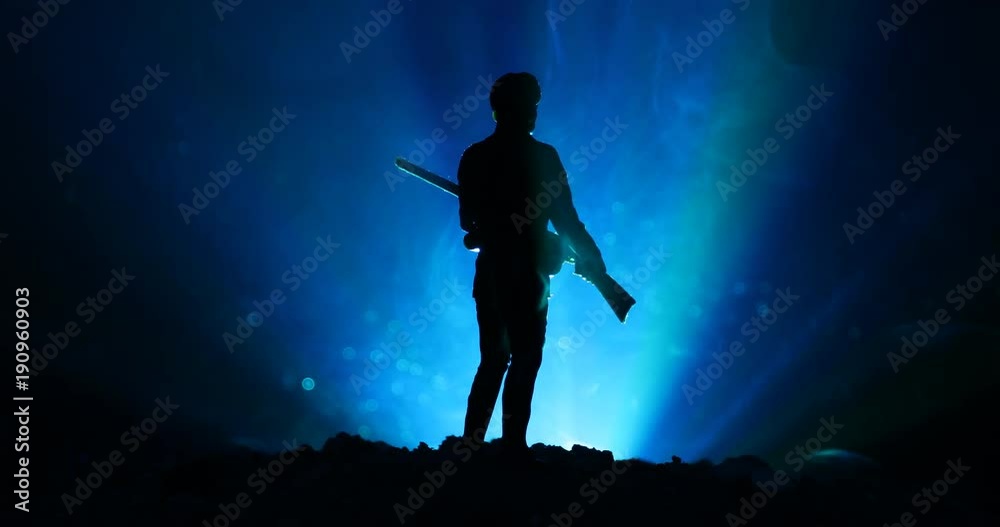 Soldier With Riffle Shadow Man with riffle at night with light rotating, or War Concept. Military ...