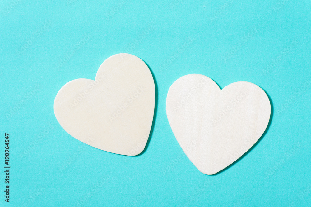 Two white hearts on green pastel background, Valentine day concept