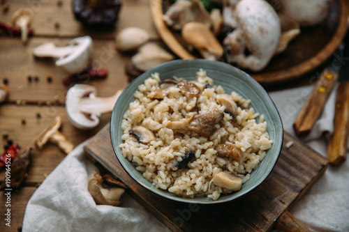 Bowl of Mushroom Risotto garnished with Thyme leaves, selective focus