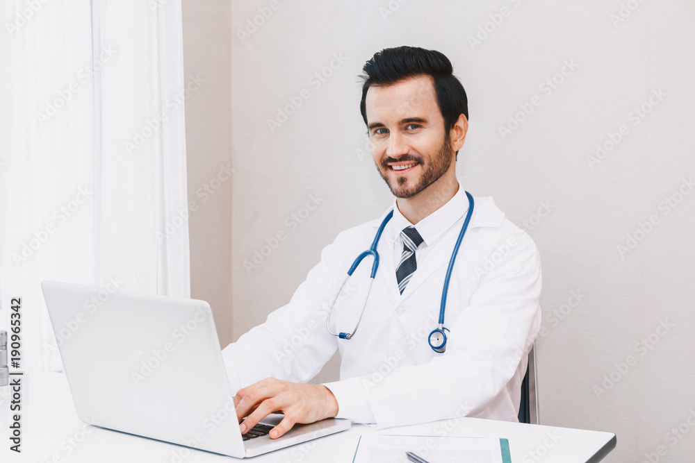 Doctor and stethoscope working with laptop computer in hospital.healthcare and medicine Doctor and stethoscope working with laptop computer in hospital.healthcare and medicine