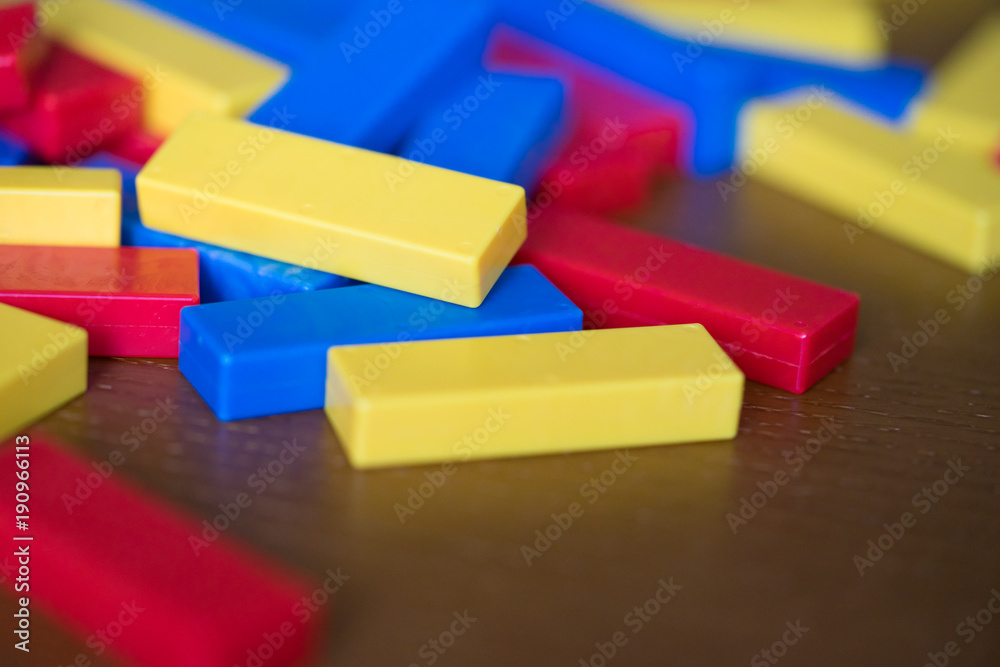 wooden toy block.Toddler girl play with blocks.Educational toys for preschool and kindergarten child.girl build wooden toy at home or daycare in christmas time. wooden toy block.Toddler girl play with blocks.Educational toys for preschool and kindergarten child.girl build wooden toy at home or daycare in christmas time.