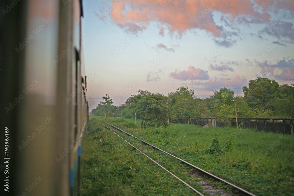 Pink clouds hover over the tracks deep in the countryside of the Burmese Railway, between Yangon and Mandalay